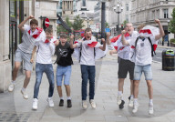 England fans roam around London's West End chanting and drinking before the Euros final match between England and Italy.