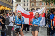 Fans celebrate ahead of England’s battle against Italy in the Euros final at Wembley. 