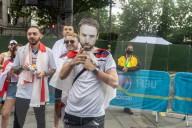 Fans celebrate ahead of England’s battle against Italy in the Euros final at Wembley. 