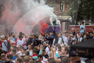 Fans celebrate ahead of England’s battle against Italy in the Euros final at Wembley. 
