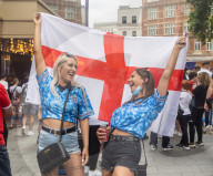 Fans celebrate ahead of England’s battle against Italy in the Euros final at Wembley. 