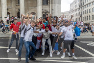 Fans celebrate ahead of England’s battle against Italy in the Euros final at Wembley. 