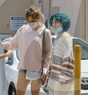 Jennifer Lopez Shows A Little Leg While Running Errands With Her Twins
