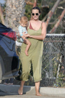 Leighton Meester, 35,  and her husband Adam Brody, 41,  are seen with their son leaving the beach after surfing.