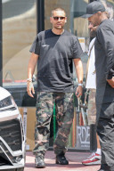 Scott Disick shows off a new buzz cut and yet another fancy new sports car to add to his growing collection of luxury automobiles. 