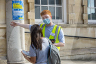 Members of the public queue outside a temporary Covid-19 vaccine centre at Battersea Arts Centre.