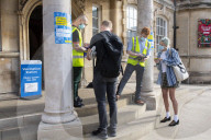 Members of the public queue outside a temporary Covid-19 vaccine centre at Battersea Arts Centre.