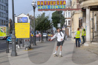 Members of the public queue outside a temporary Covid-19 vaccine centre at Battersea Arts Centre.