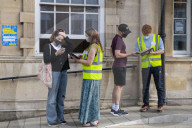 Members of the public queue outside a temporary Covid-19 vaccine centre at Battersea Arts Centre.