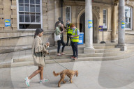 Members of the public queue outside a temporary Covid-19 vaccine centre at Battersea Arts Centre.