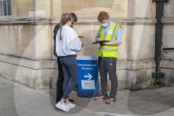 Members of the public queue outside a temporary Covid-19 vaccine centre at Battersea Arts Centre.