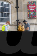 Members of the public queue outside a temporary Covid-19 vaccine centre at Battersea Arts Centre.