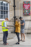Members of the public queue outside a temporary Covid-19 vaccine centre at Battersea Arts Centre.
