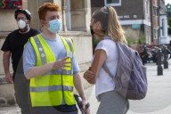 Members of the public queue outside a temporary Covid-19 vaccine centre at Battersea Arts Centre.