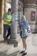 Members of the public queue outside a temporary Covid-19 vaccine centre at Battersea Arts Centre.