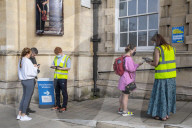 Members of the public queue outside a temporary Covid-19 vaccine centre at Battersea Arts Centre.
