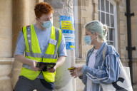 Members of the public queue outside a temporary Covid-19 vaccine centre at Battersea Arts Centre.