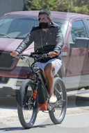 Simon Cowell takes his electric bike for a spin around Malibu without a helmet as he is seen in LA for the first time since returning from his summer vacation in Barbados.