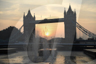 Sunrise today over the city of London and London Bridge 