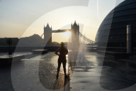 Sunrise today over the city of London and London Bridge 