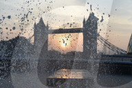 Sunrise today over the city of London and London Bridge 