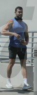 Sam Asghari shows off his muscular figure as he leaves a workout with a friend on Sunday afternoon. 