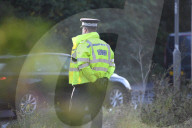 Police watch for protesters today on the M25. 