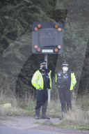Police watch for protesters today on the M25. 