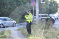 Police watch for protesters today on the M25. 