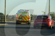 Police watch for protesters today on the M25. 