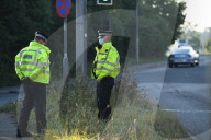 Police watch for protesters today on the M25. 