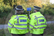 Police watch for protesters today on the M25. 