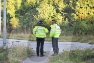 Police watch for protesters today on the M25. 