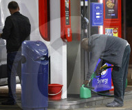 Motorists queue for fuel