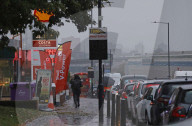 Motorists queue for fuel