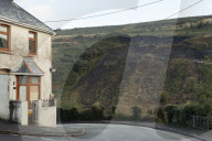 Welsh government calls on Westminster to help fund safety of coal tips. Rhondda valley residents fearful after recent landslip and UK government pushed to share responsibility