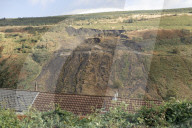 Welsh government calls on Westminster to help fund safety of coal tips. Rhondda valley residents fearful after recent landslip and UK government pushed to share responsibility