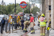 Fire at Westminster Station as severe flooding hits London after torentail rain last night. 