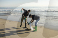 Huntington Beach oil spill blackens beaches and waves.