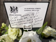 Boris Johnson and Priti Patel pay respects to Sir David Amess