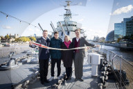 Rodney Morgan-Giles is handing over the Captain’s pennant to Nigel Steel - head of content on HMS Belfast and IWM curator. 