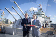 Rodney Morgan-Giles is handing over the Captain’s pennant to Nigel Steel - head of content on HMS Belfast and IWM curator. 