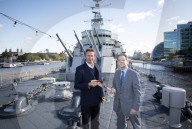 Rodney Morgan-Giles is handing over the Captain’s pennant to Nigel Steel - head of content on HMS Belfast and IWM curator. 