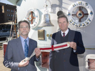 Rodney Morgan-Giles is handing over the Captain’s pennant to Nigel Steel - head of content on HMS Belfast and IWM curator. 