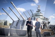 Rodney Morgan-Giles is handing over the Captain’s pennant to Nigel Steel - head of content on HMS Belfast and IWM curator. 