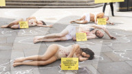 Protestors lie ‘dead’ in meat industry ‘crime scene’ on world vegan day, Piccadilly Circus, London, UK.