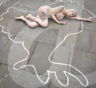 Protestors lie ‘dead’ in meat industry ‘crime scene’ on world vegan day, Piccadilly Circus, London, UK.