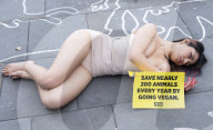 Protestors lie ‘dead’ in meat industry ‘crime scene’ on world vegan day, Piccadilly Circus, London, UK.