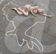 Protestors lie ‘dead’ in meat industry ‘crime scene’ on world vegan day, Piccadilly Circus, London, UK.