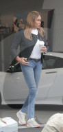 An extremely smooth faced Caitlyn Jenner, 72, drives one of her flashy sports cars to a classic auto show in Westlake Village, California, on Halloween.
